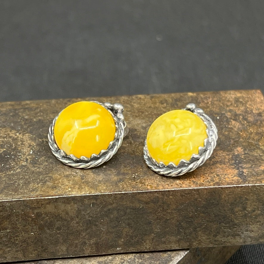A pair of clip-on earrings with milky amber