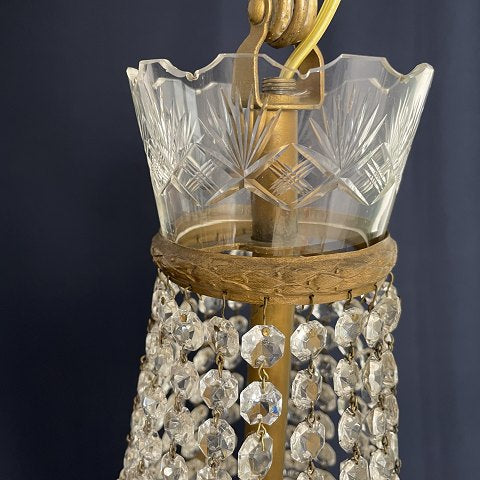 Fine dense chandelier with glass crown and garland