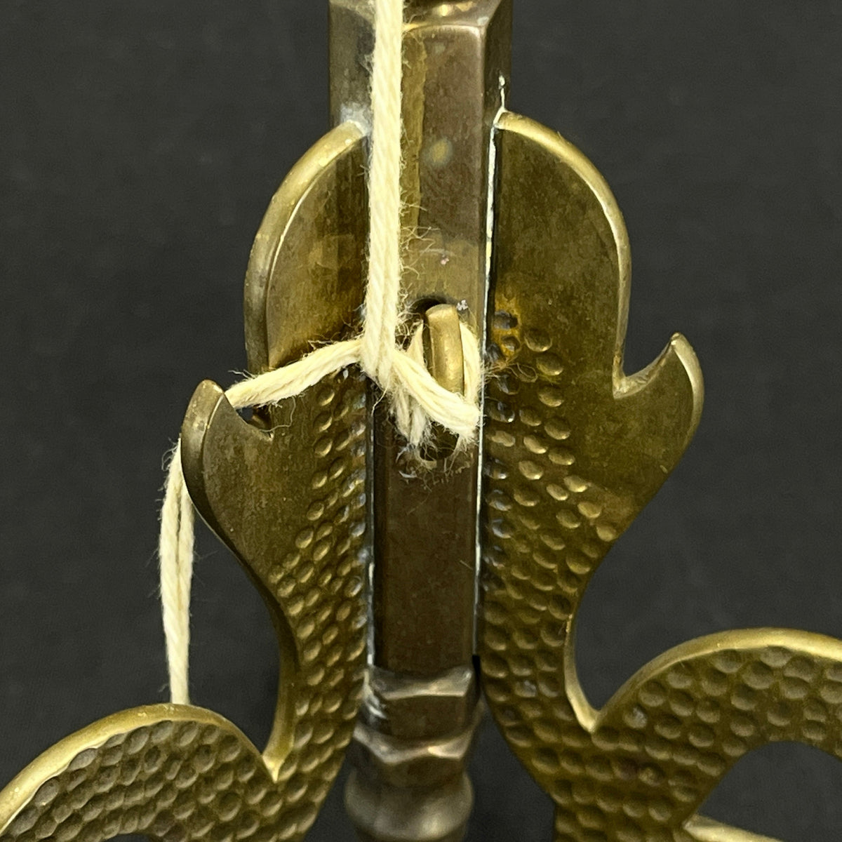 Tall brass flagpole with Midgard snakes