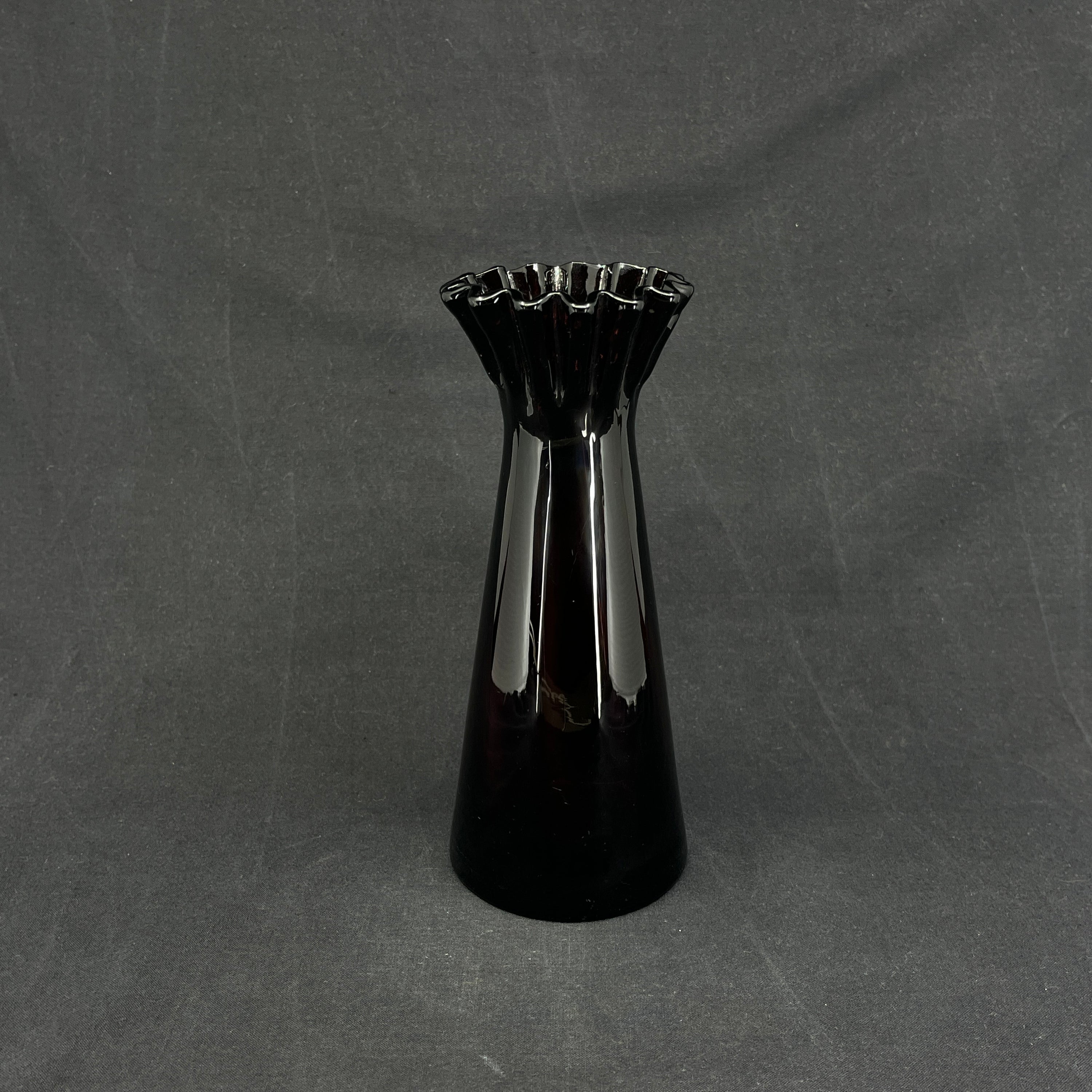 Manganese-colored hyacinth glass with ruffled edge