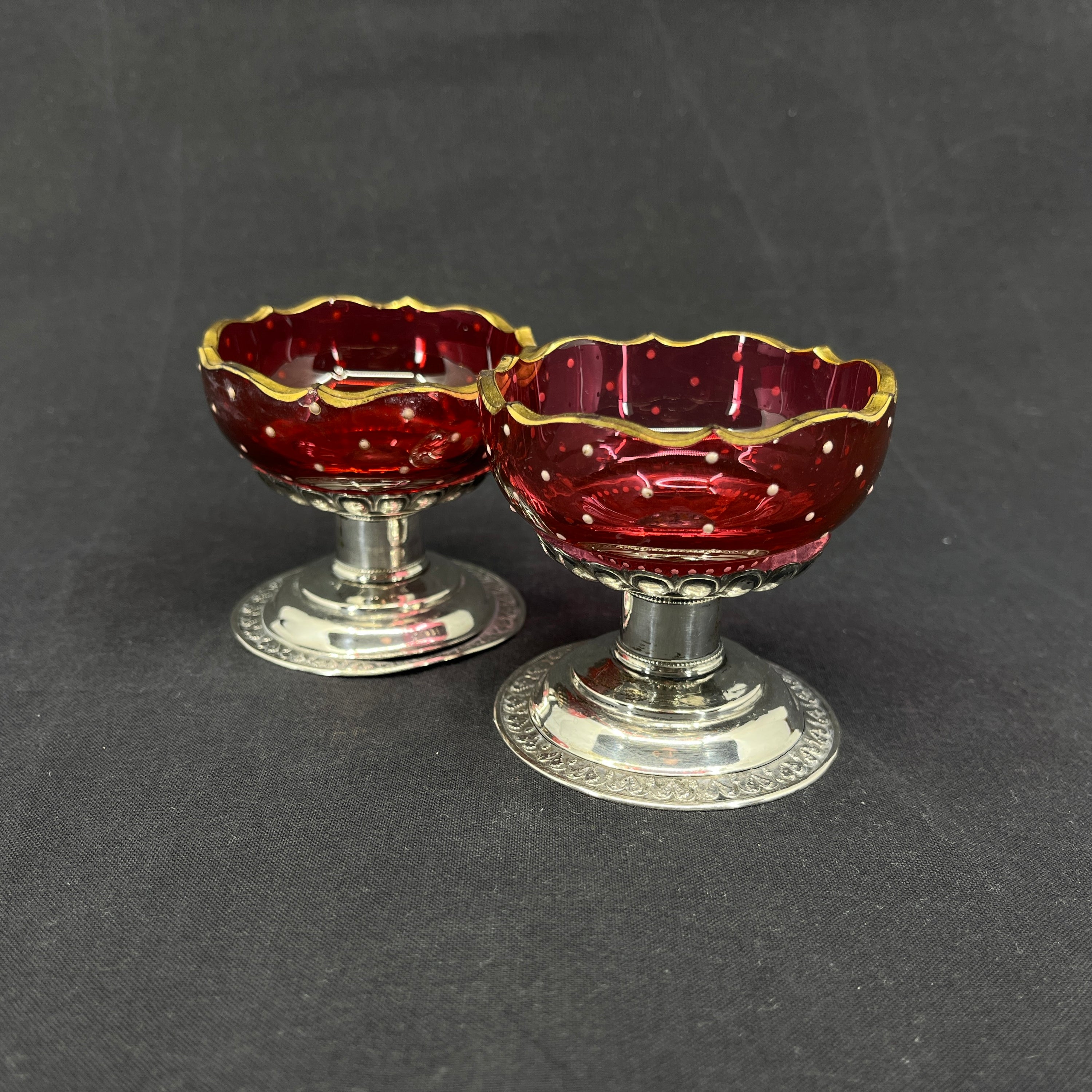 A pair of 18th century salt cellars with silver feet