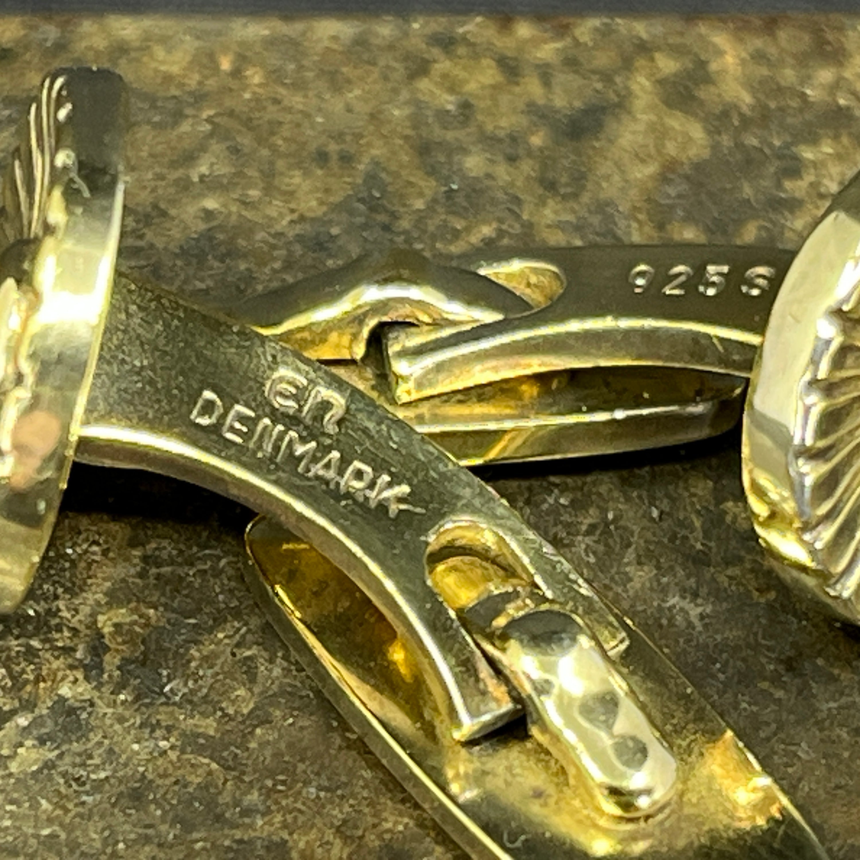 A pair of gilded cufflinks by Evald Nielsen