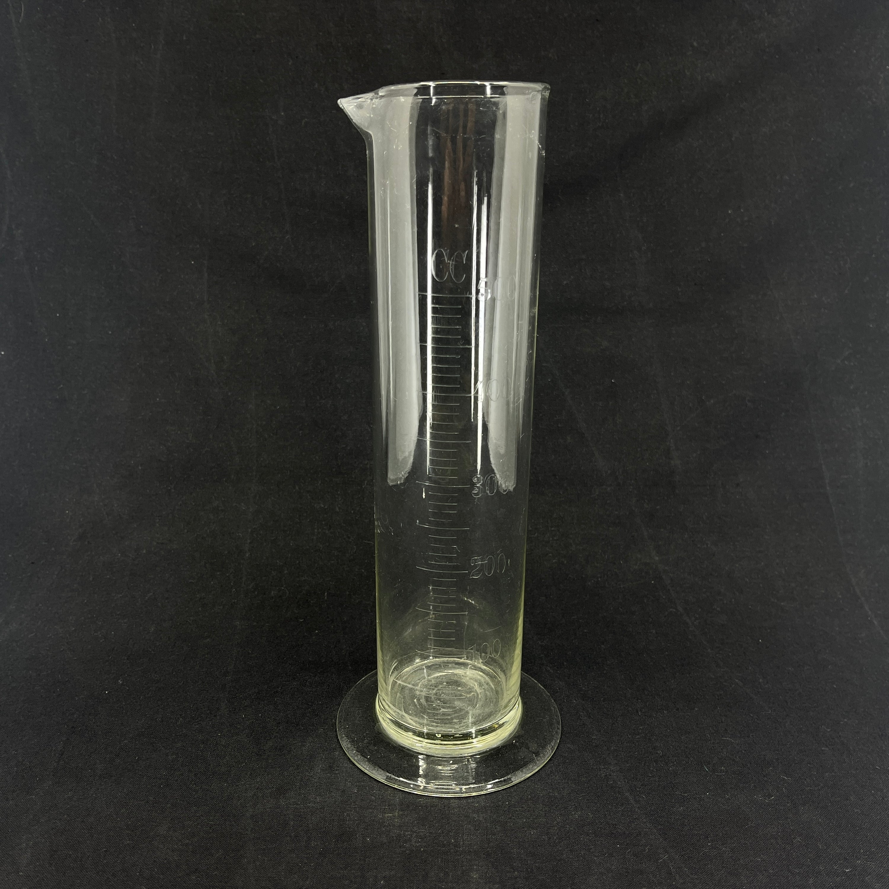 Large antique centiliter measure from pharmacy
