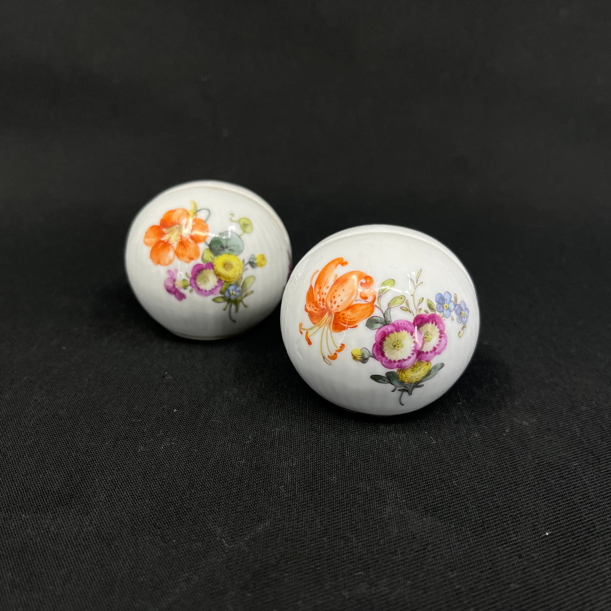 A pair of Saxon Flower place card holders