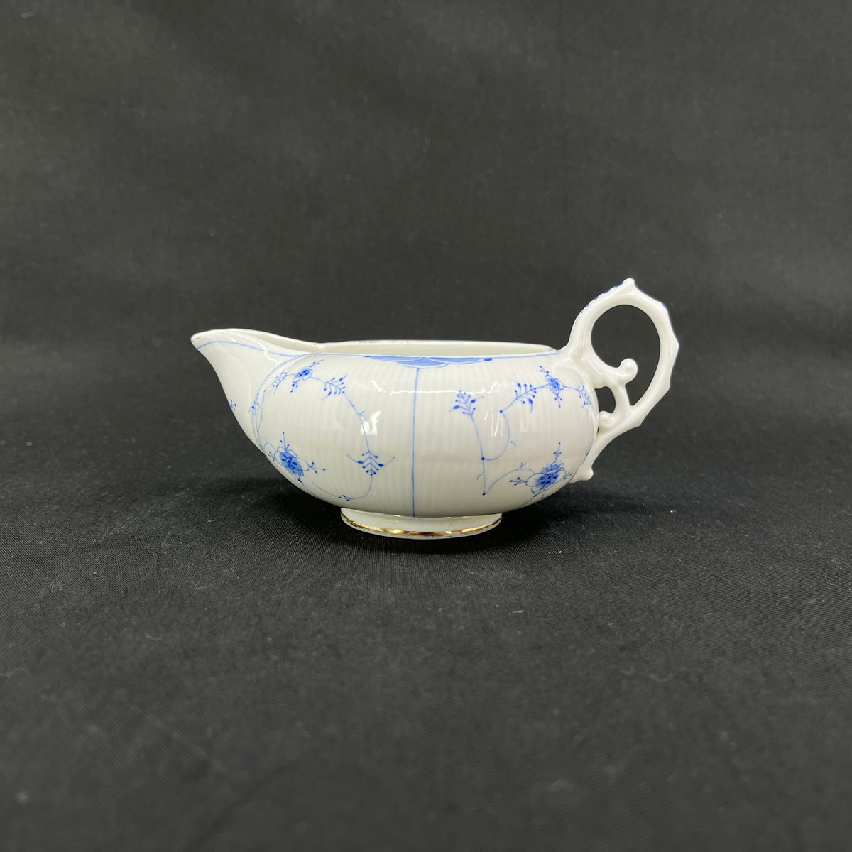 Rare Blue Fluted creamer from Bing & Grøndahl with gold trim.