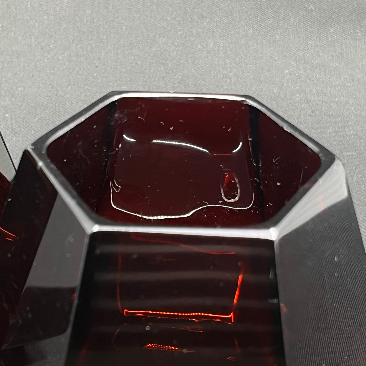 A pair of angular ruby red art deco vases