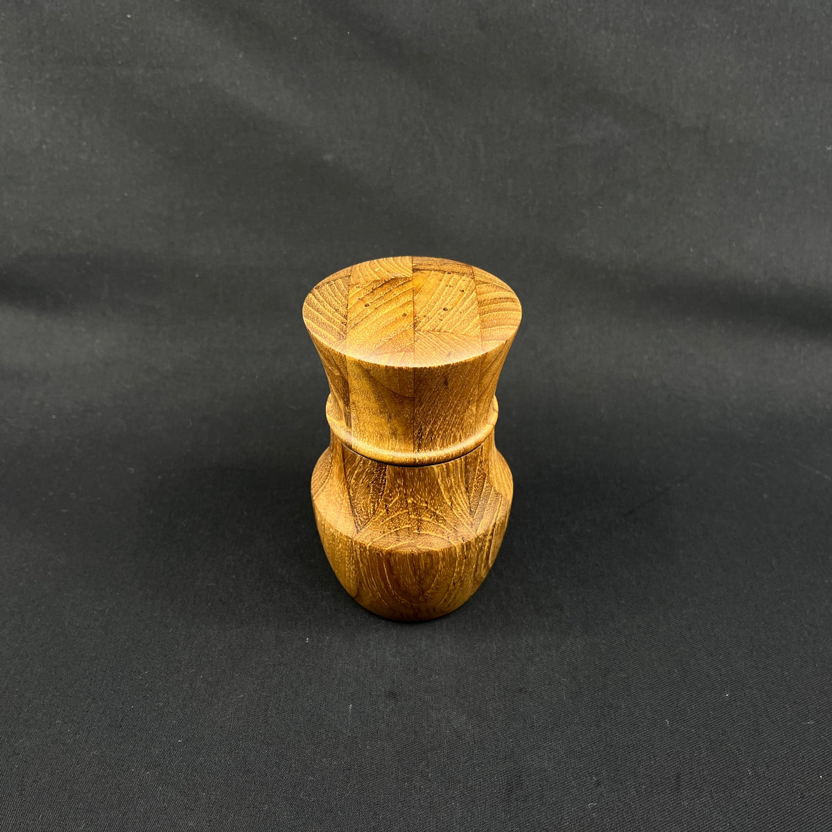 Modern pepper mill in teak