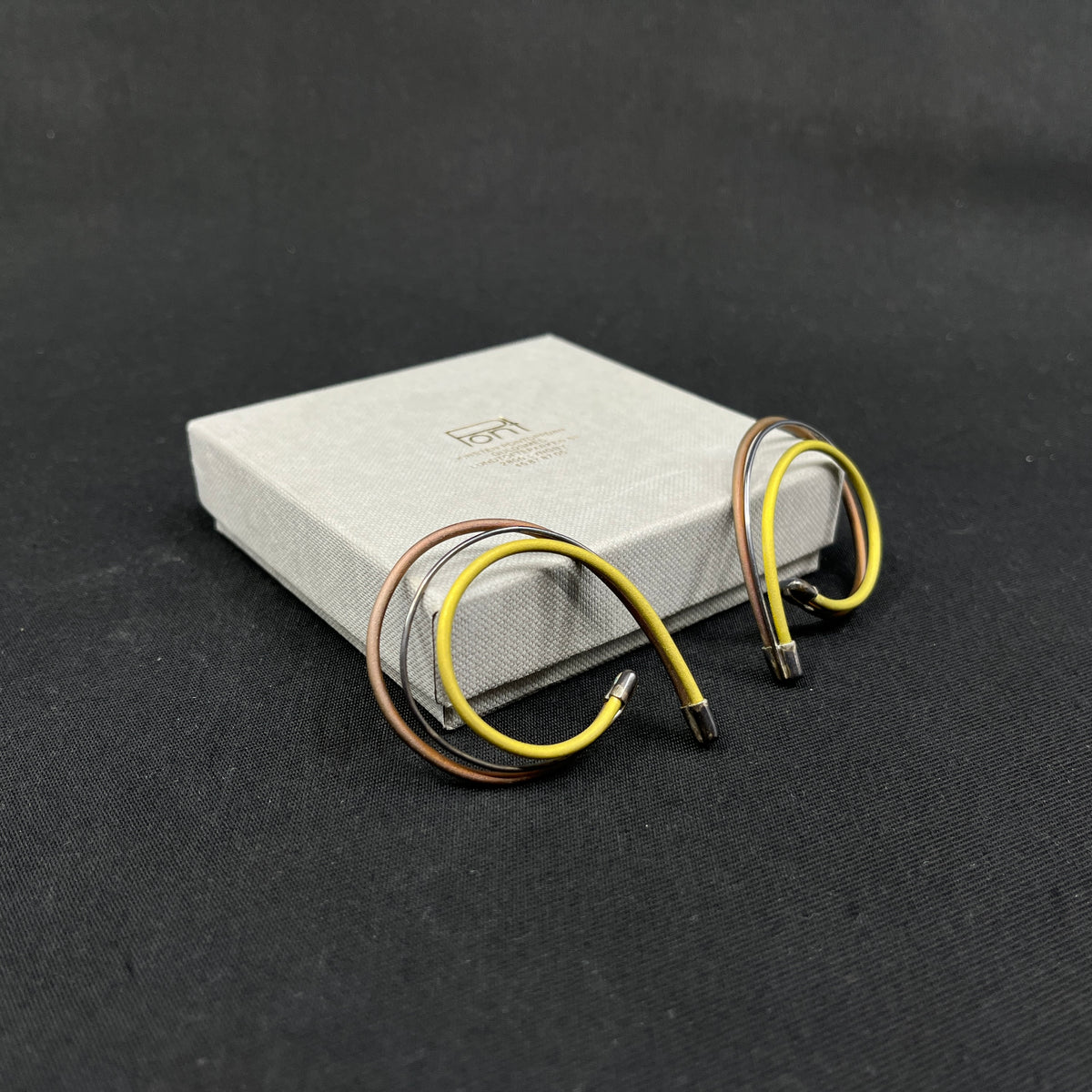 A pair of earrings by Kirsten Pontoppidan - yellow and brown