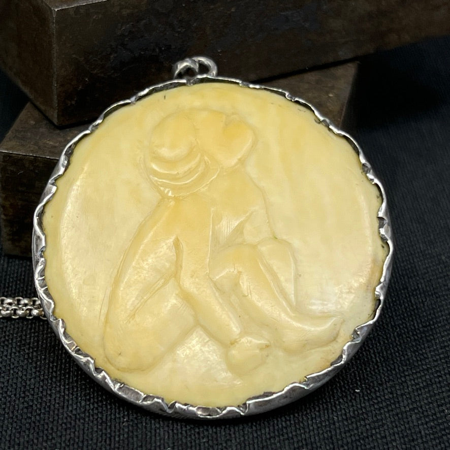 Bone pendant set in silver