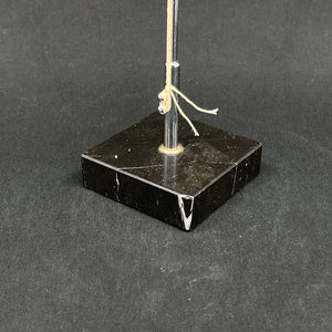 Flagpole with black marble base