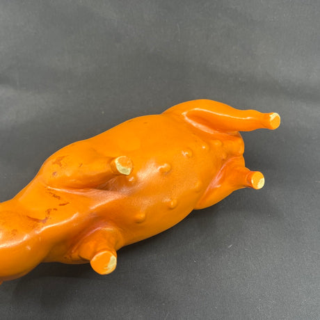 Red-orange piggy bank from the 1930s