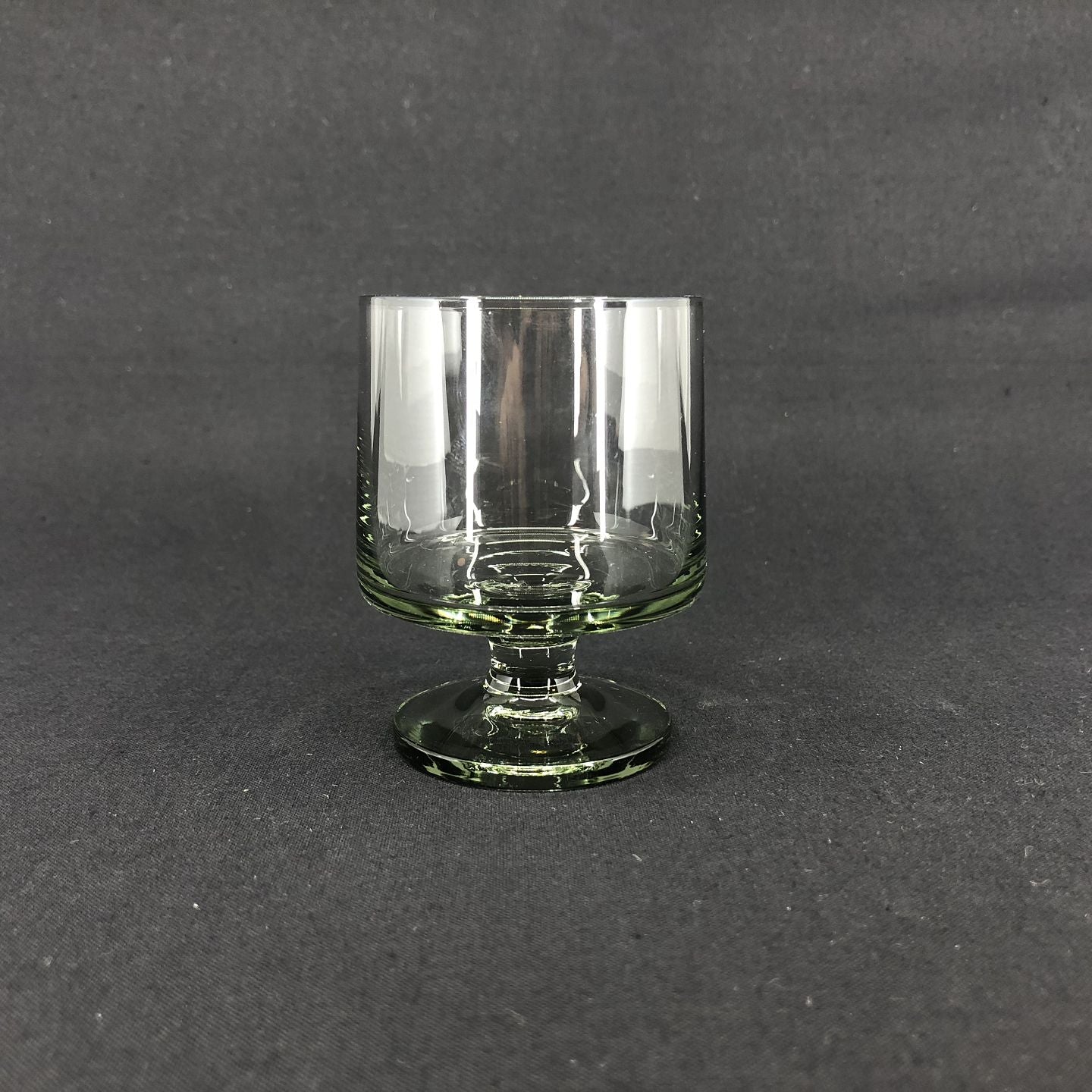 Stub white wine glass, smoke
