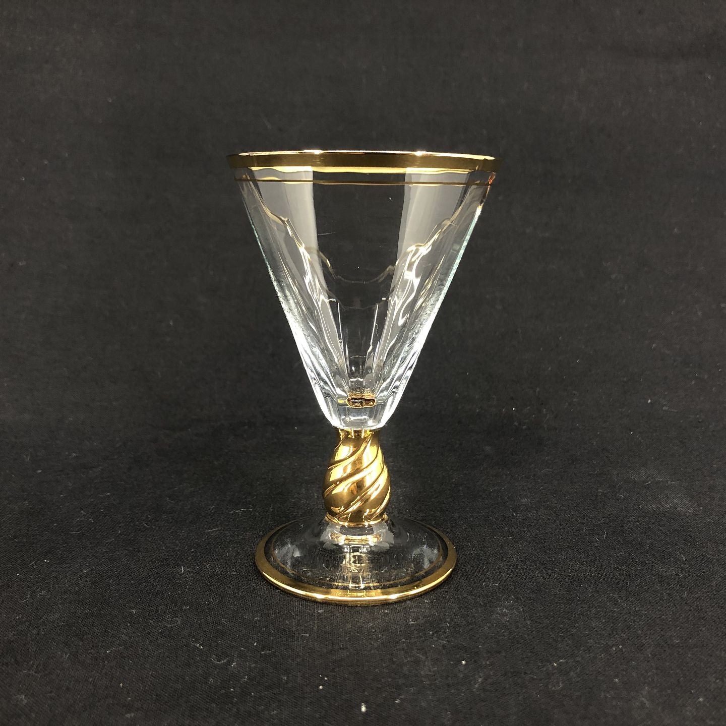 Ida with gold port wine glass