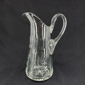 Fine glass jug with many cuts