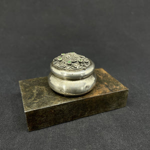 Small silver box with powder brush
