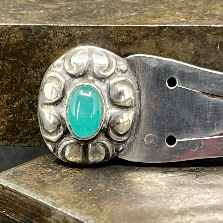 Silver bookmark with a green stone