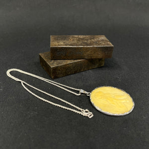 Bone pendant set in silver