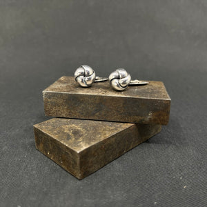 A pair of cufflinks - knots