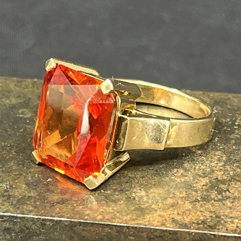 Modern cocktail ring with orange stones