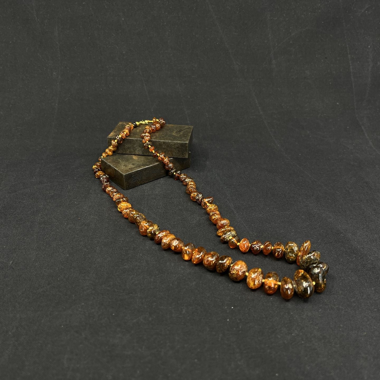 Necklace with polished amber pieces