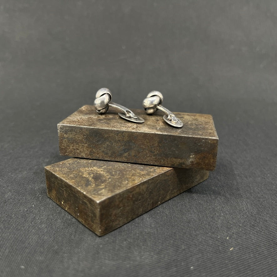 A pair of cufflinks - knots