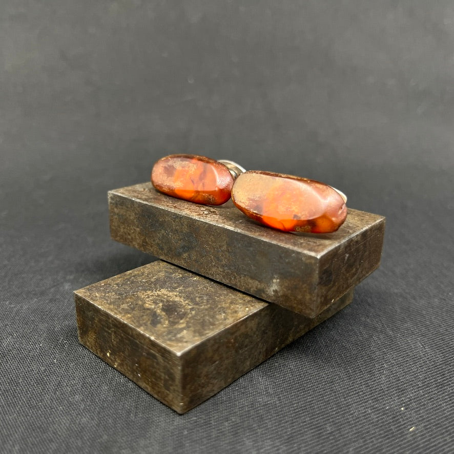 A pair of cufflinks with amber