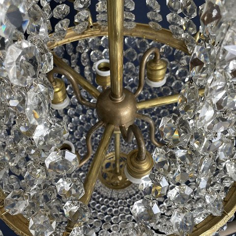 Fine old chandelier with gilded frame