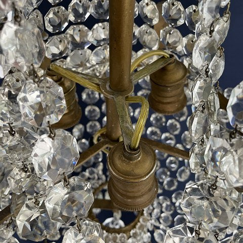 Fine dense chandelier with glass crown and garland