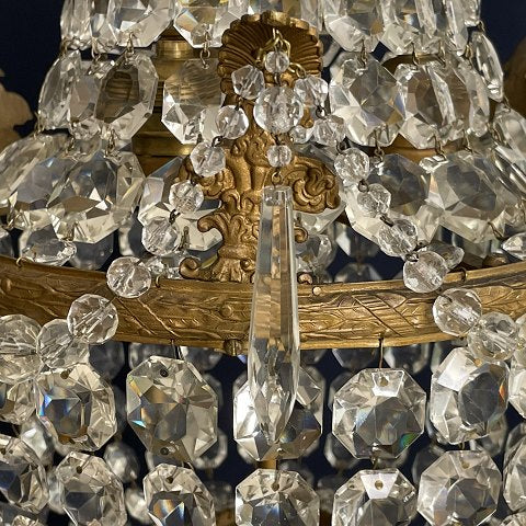 Fine dense chandelier with glass crown and garland