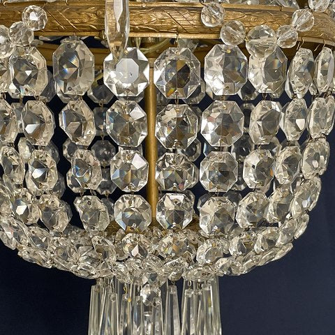 Fine dense chandelier with glass crown and garland