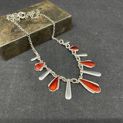 Fine necklace with red enamel