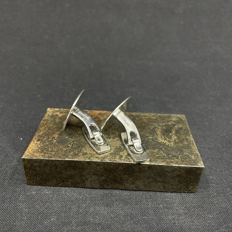 A pair of sterling silver cufflinks