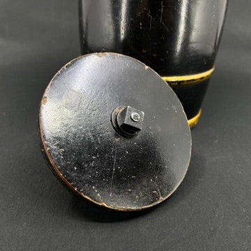 Tobacco box from 1910–1920, shaped like a barrel.