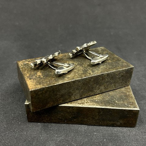 A pair of modernist cufflinks