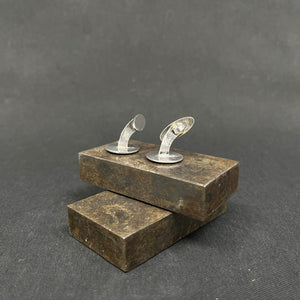 A pair of cufflinks with Ping