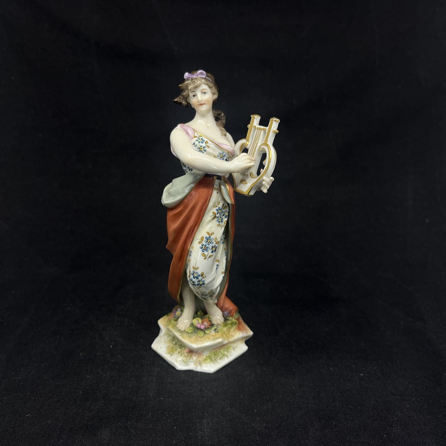 19th century Meissen figure of a lady with a lyre