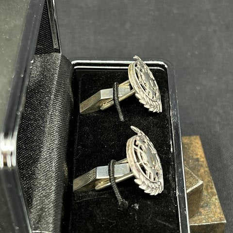 A pair of FN cufflinks