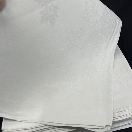16 identical napkins in damask