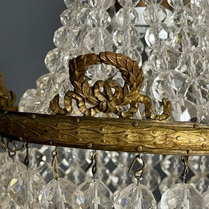 Unusually small prism chandelier – pearls on a string