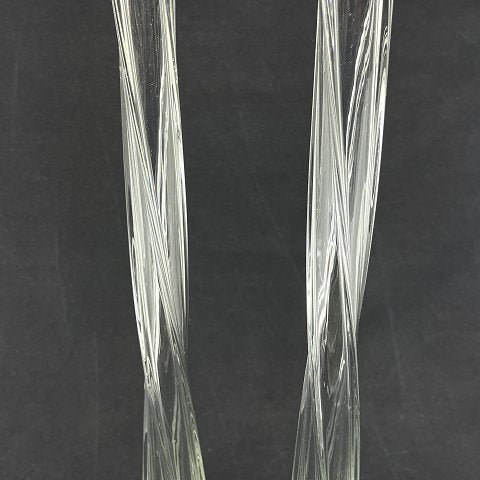 A pair of tall slender lily vases