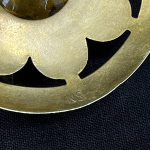Large gilded brooch with stones