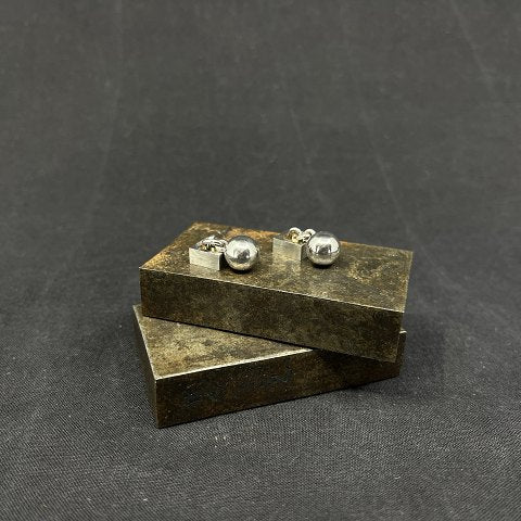 A pair of modern cufflinks in silver