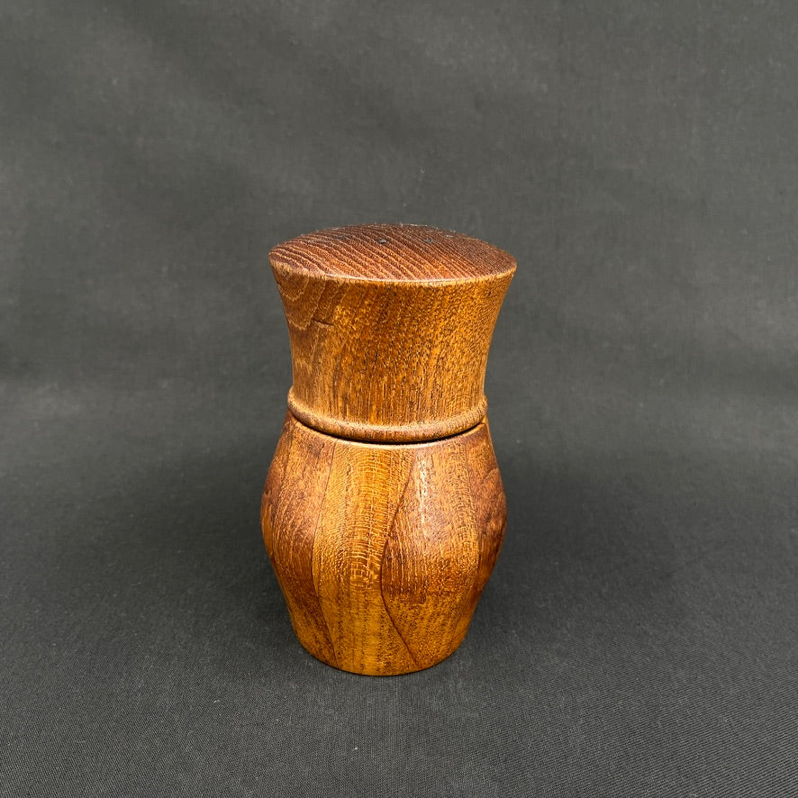 Modern pepper mill in teak