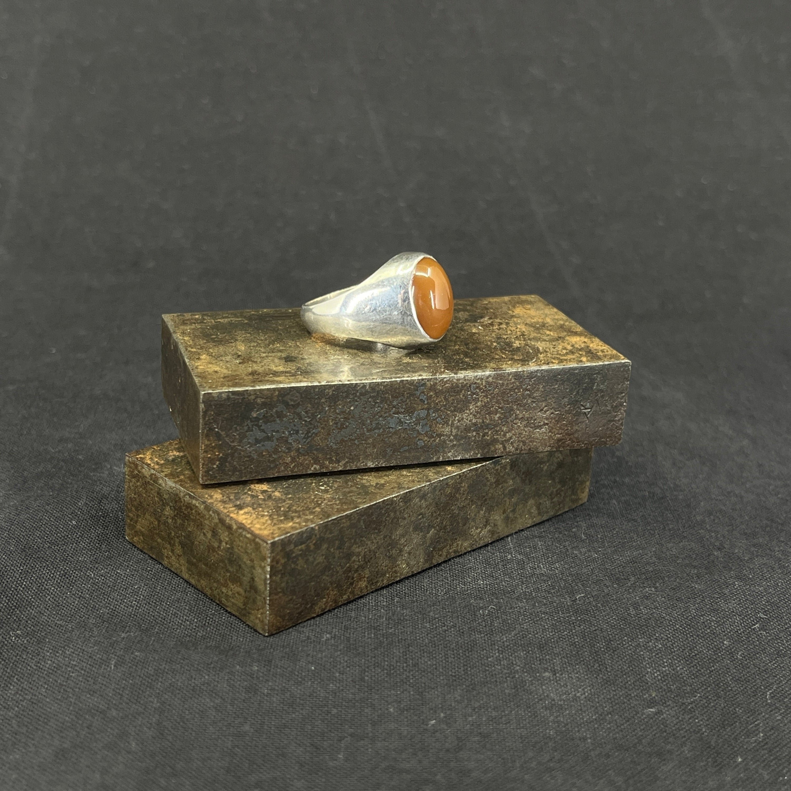 Ring with reddish stone