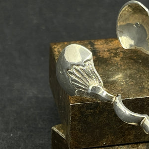Baroque sugar tongs in silver