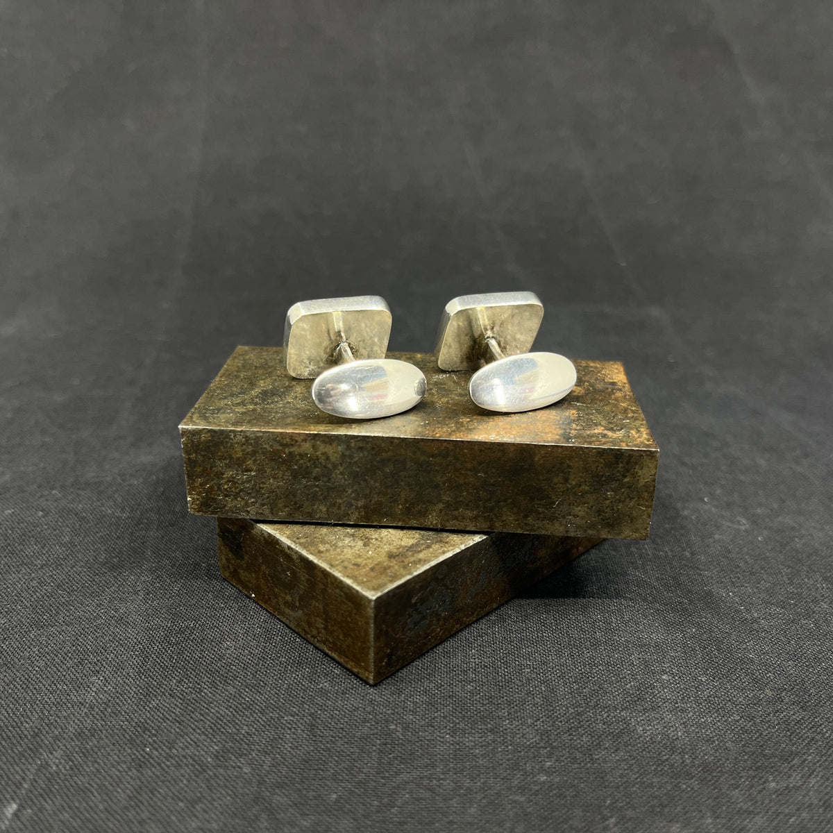 A pair of cufflinks with stones
