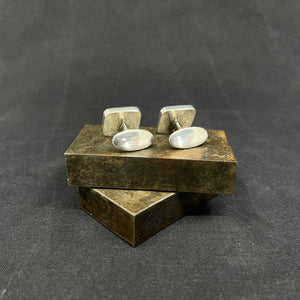 A pair of cufflinks with stones