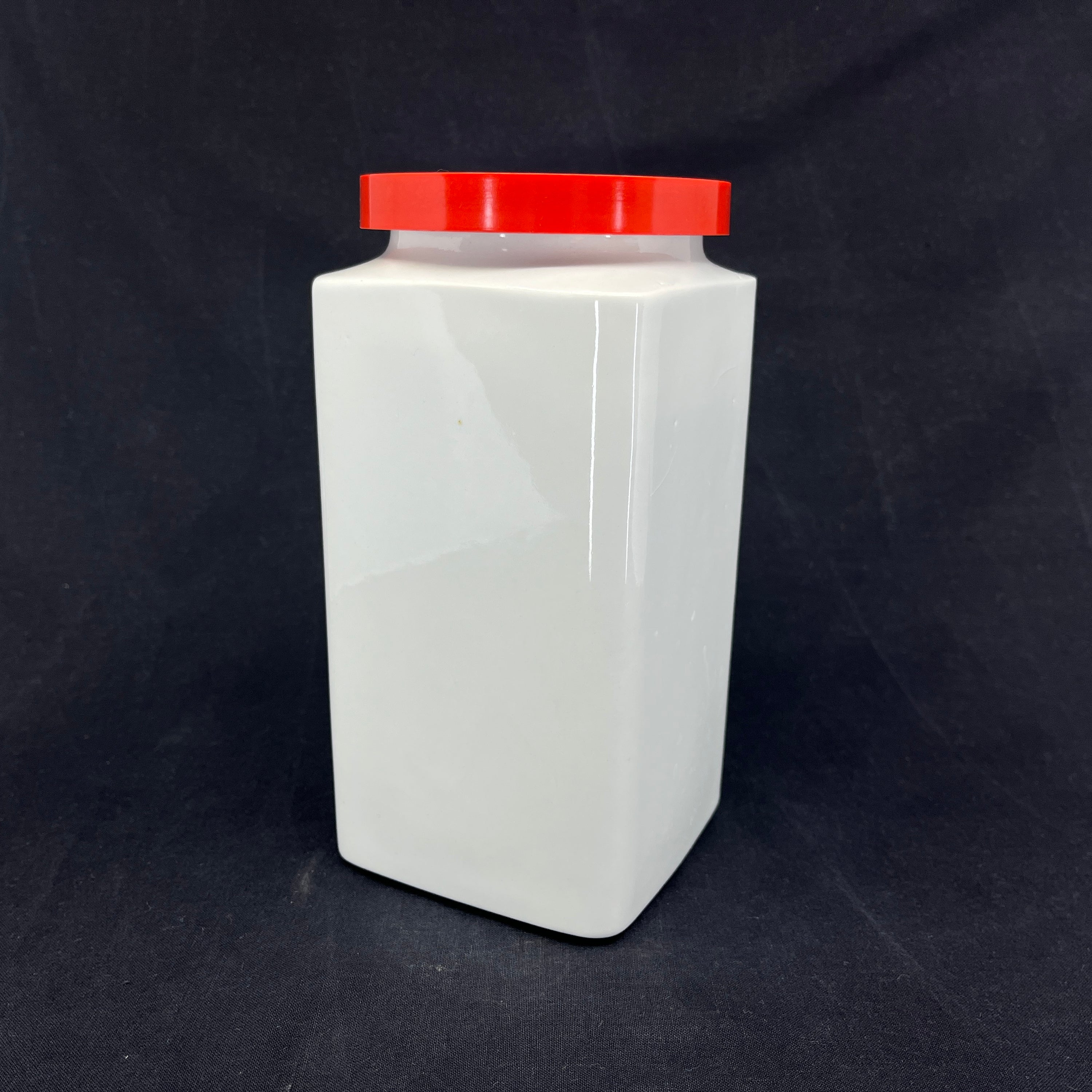 Arabia storage jar with red lid