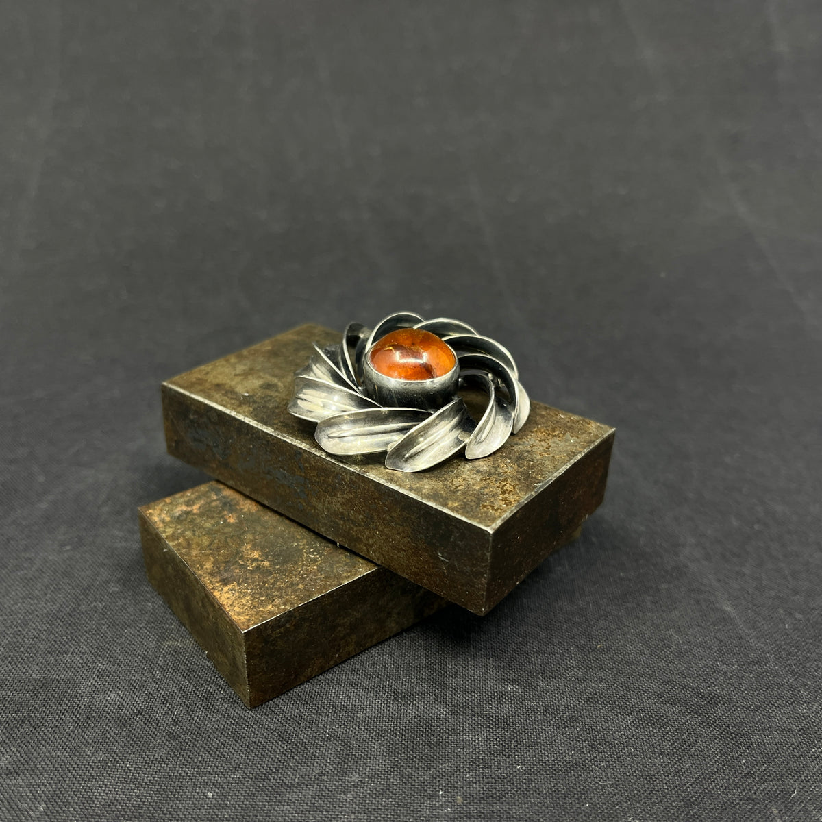 Modern silver brooch with amber
