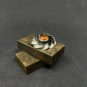 Modern silver brooch with amber